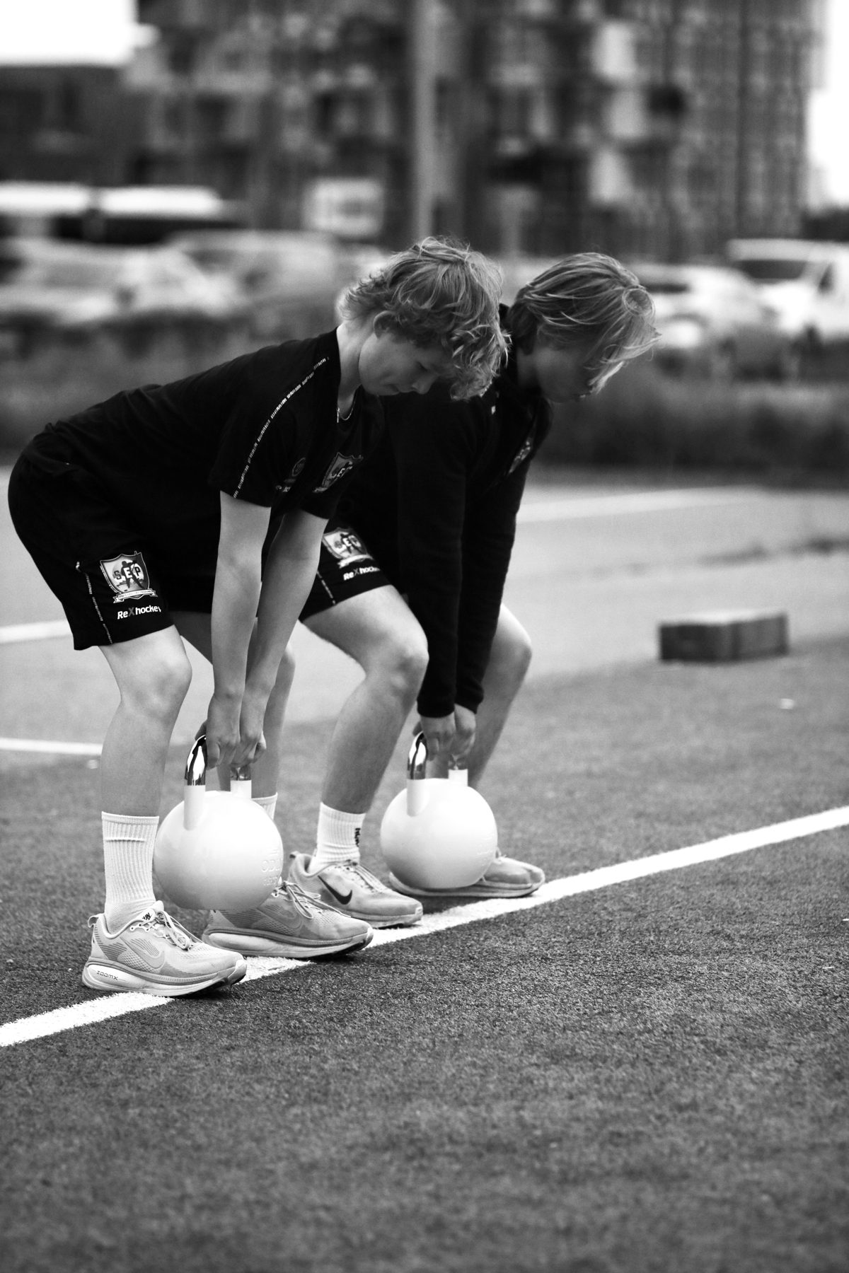 Red Team Training athlete pressing a kettlebell